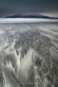 Sand patterns and view to Rum From the isle of Eigg